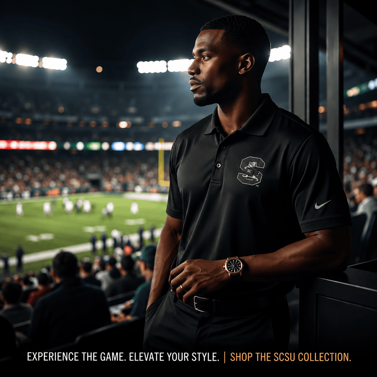 Man in polo overlooking crowded football stadium